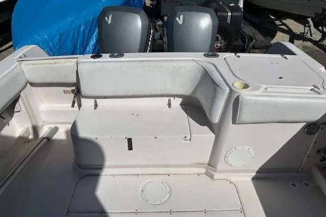 Slide: The Image of 1999 Grady-White Sailfish 272 boat interior with dual outboard motors. - 25