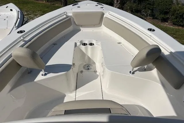 Slide: The Image of 2026 Key West 239 FS boat interior with seating and cup holders. - 10