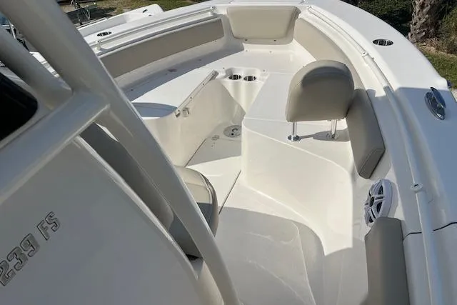Slide: The Image of 2026 Key West 239 FS boat interior with seating and cup holders. - 11