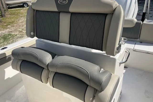 Slide: The Image of 2026 Key West 239 FS boat seating with cushioned backrest and armrests. - 4