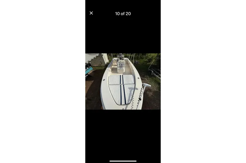 Slide: The Image of 2014 Young Boats 24 Center Console Bay Boat, top view, showcasing deck and console. - 3