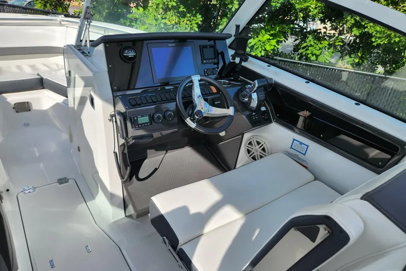 Slide: The Image of 2020 Blackfin 272 DC boat cockpit with modern controls and seating. - 10