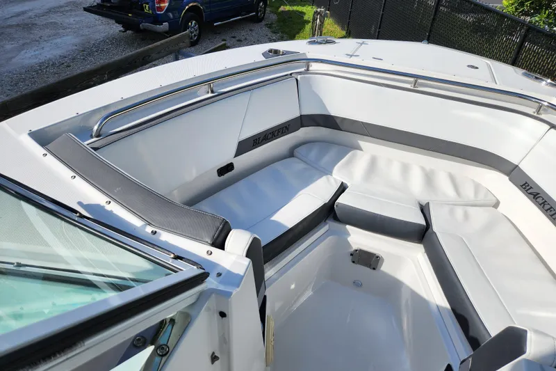 Slide: The Image of 2020 Blackfin 272 DC boat interior with cushioned seating and sleek design. - 14