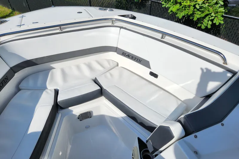 Slide: The Image of 2020 Blackfin 272 DC boat interior with white cushioned seating and stainless steel railing. - 15