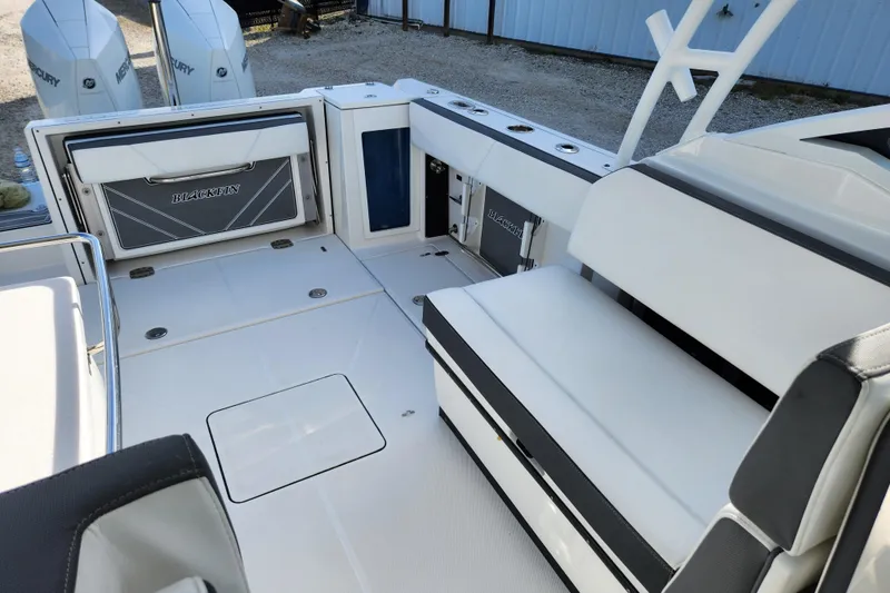 Slide: The Image of 2020 Blackfin 272 DC boat interior with seating and storage compartments. - 18