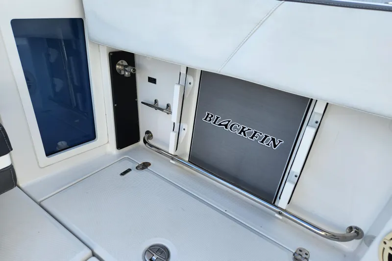 Slide: The Image of 2020 Blackfin 272 DC boat interior with branded storage compartment. - 21