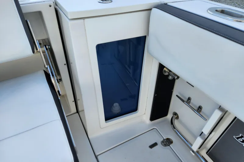 Slide: The Image of Interior view of a 2020 Blackfin 272 DC boat, featuring seating and storage compartments. - 22