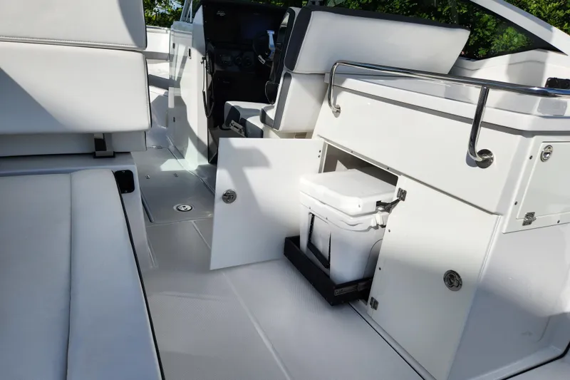 Slide: The Image of 2020 Blackfin 272 DC boat interior with seating and storage compartments. - 25