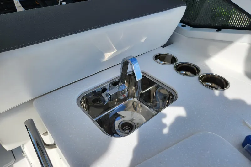 Slide: The Image of 2020 Blackfin 272 DC boat sink and cup holders on deck. - 28
