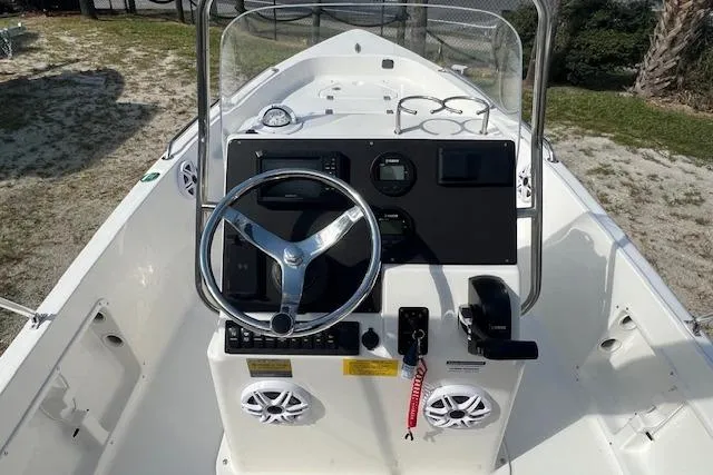 Slide: The Image of 2026 Key West 1720 Center Console boat interior with steering wheel and controls. - 4