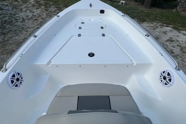 Slide: The Image of 2026 Key West 1720 Center Console boat interior with seating and storage compartments. - 7