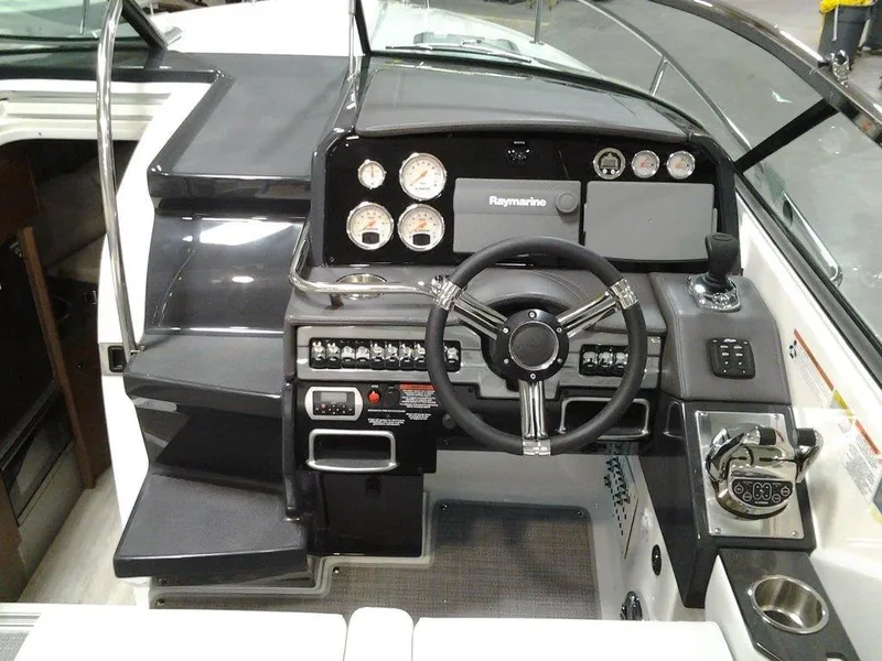 Slide: The Image of Engine compartment of a 2018 Formula 310 Sun Sport boat, showcasing dual powerful engines. - 12