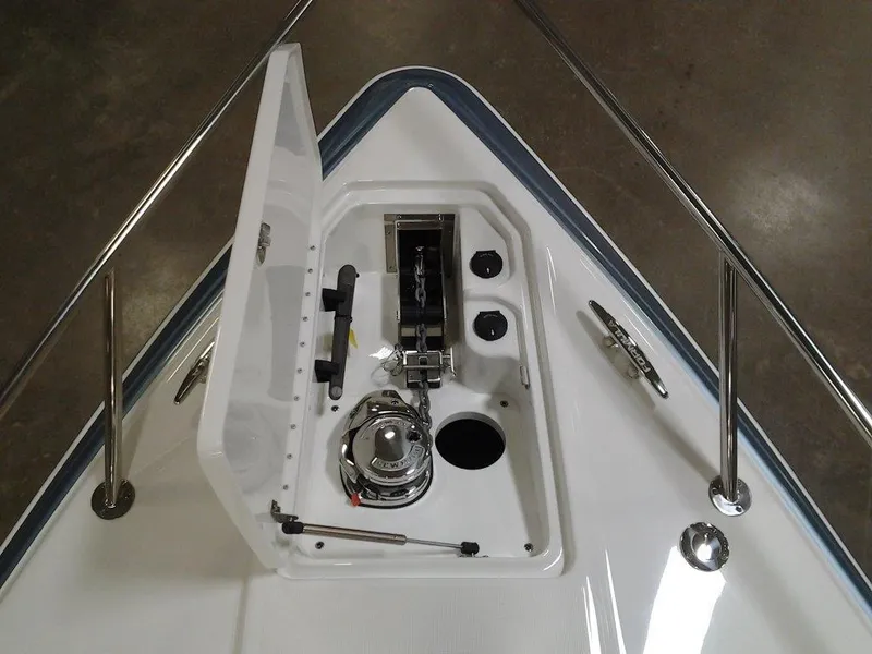 Slide: The Image of 2018 Formula 310 Sun Sport boat with open windshield and sleek white deck. - 18