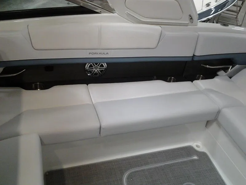 Slide: The Image of Interior of 2018 Formula 310 Sun Sport boat, featuring wooden door and seating area. - 31