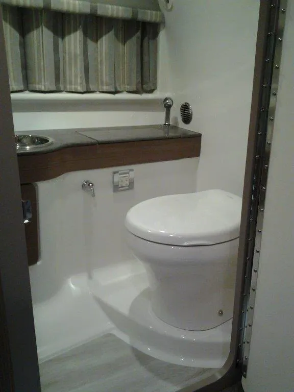 Slide: The Image of 2018 Formula 310 Sun Sport boat interior with white seating and sleek design. - 32