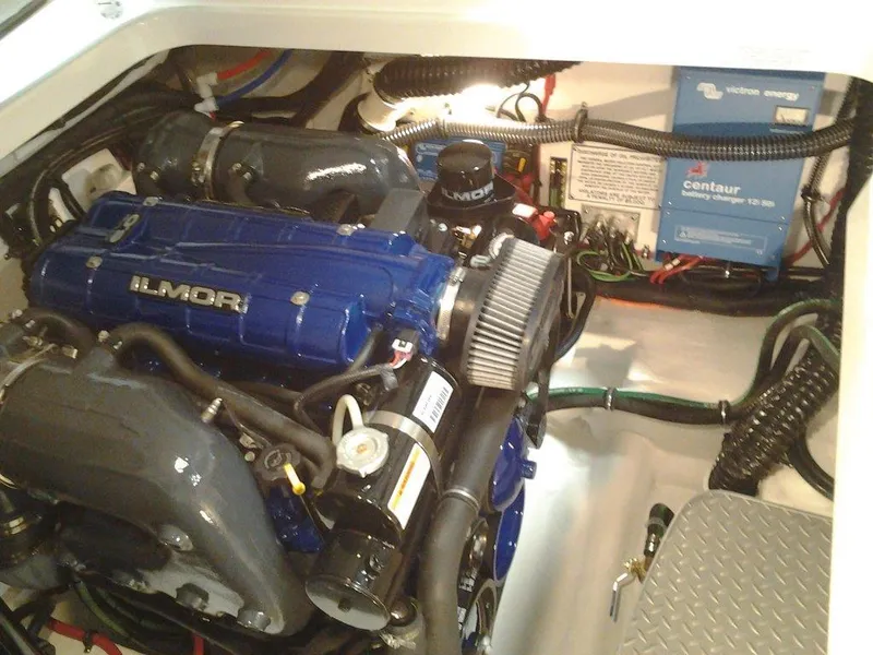 Slide: The Image of 2018 Formula 310 Sun Sport boat docked in a marina, featuring sleek design and American flag. - 7