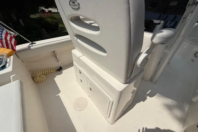 Slide: The Image of 2020 Cobia 220 Center Console boat interior with seating and storage compartments. - 10