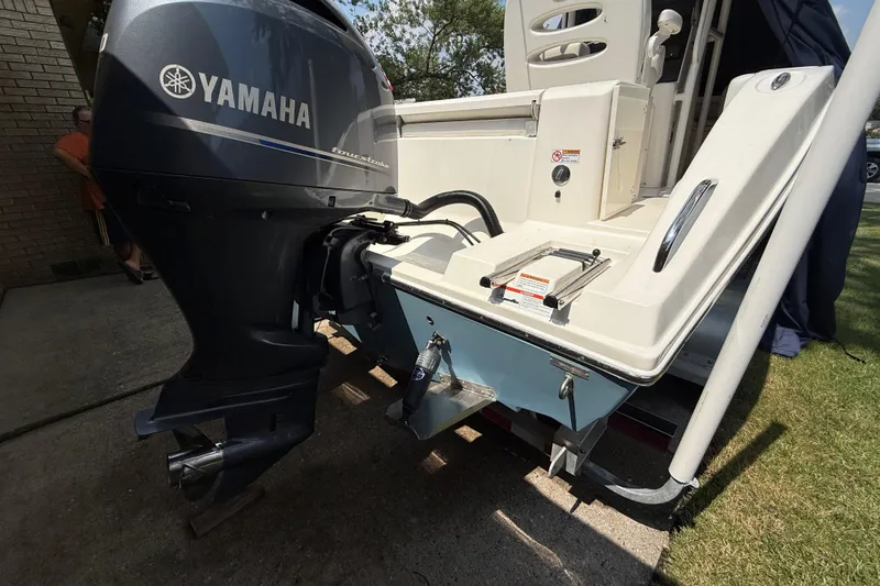 Slide: The Image of 2020 Cobia 220 Center Console with Yamaha outboard motor, rear view. - 6