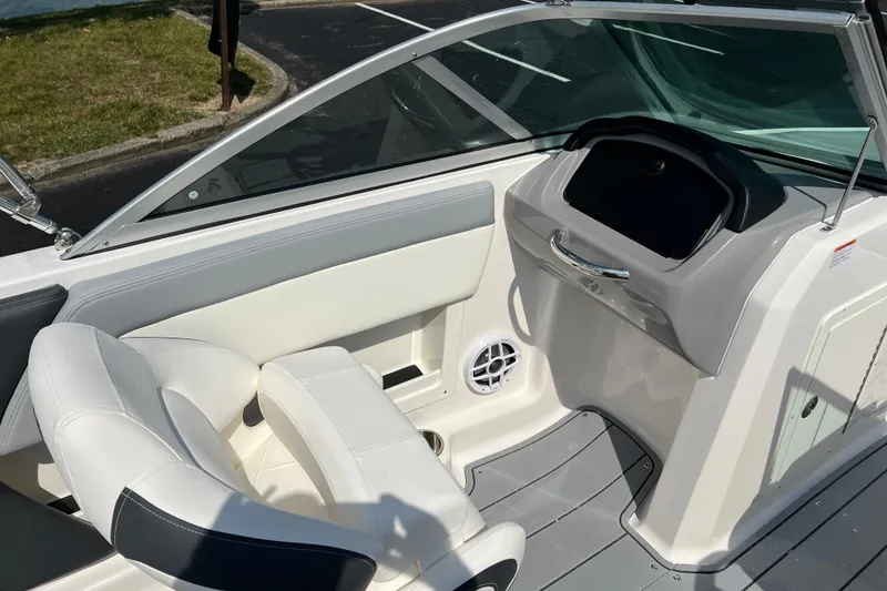 Slide: The Image of 2026 CHAPPARAL 19 SSi OB boat interior with white seating and dashboard. - 13