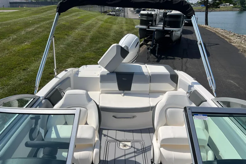 Slide: The Image of 2026 CHAPPARAL 19 SSi OB boat interior with white seating and sleek design. - 16