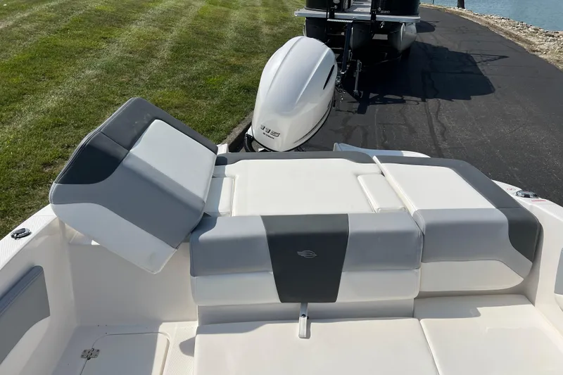 Slide: The Image of 2026 CHAPPARAL 19 SSi OB boat with sleek seating and outboard motor. - 21