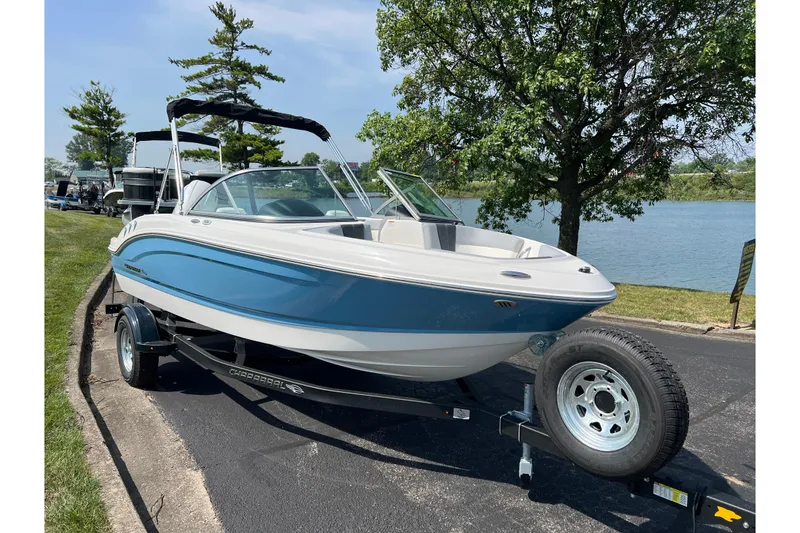 Slide: The Image of 2026 CHAPPARAL 19 SSi OB boat on trailer by a lakeside, sunny day. - 3