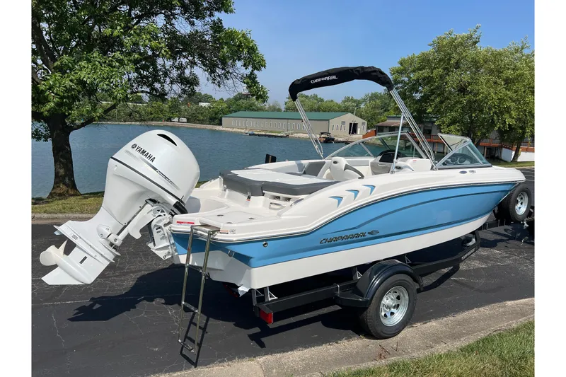 Slide: The Image of 2026 CHAPPARAL 19 SSi OB boat with Yamaha outboard motor by a lake. - 5