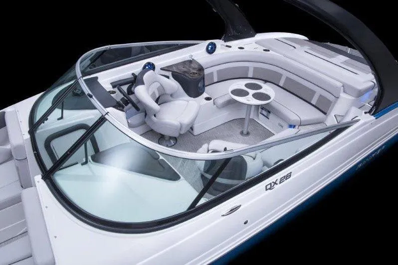 Slide: The Image of Manufacturer Provided Image: 2018 Rinker QX26 BR boat interior with seating and table. - 25