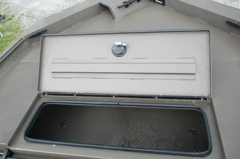 Slide: The Image of 2025 Alweld 1756 CC VV Marsh Jon boat storage compartment open, showing interior. - 14