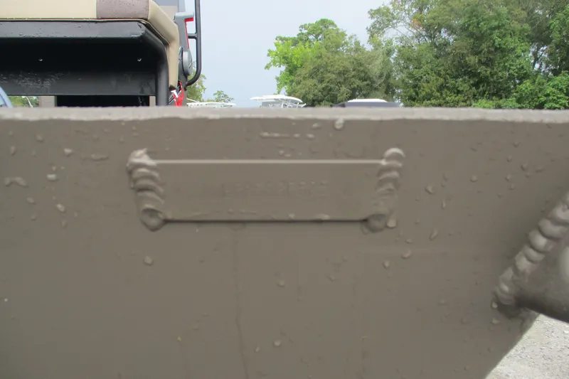 Slide: The Image of 2025 Alweld 1756 CC VV Marsh Jon boat with wet surface and visible welds. - 16