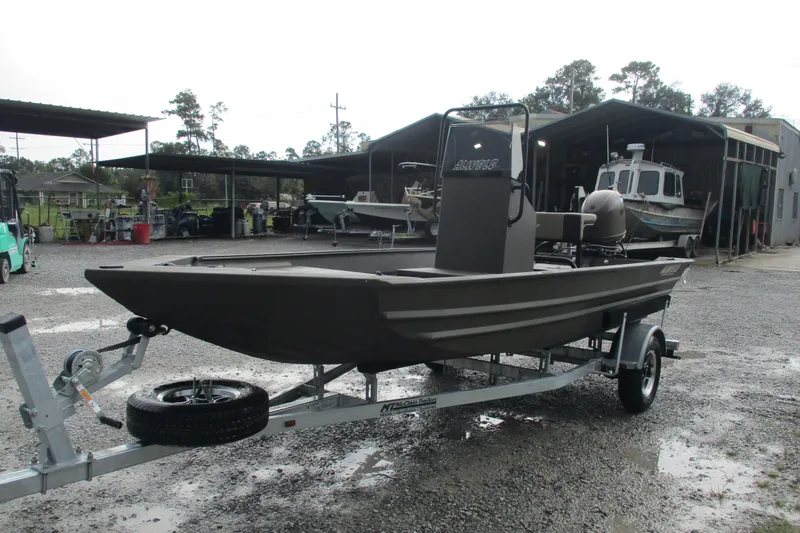 Slide: The Image of 2025 Alweld 1756 CC VV Marsh Jon boat on trailer in outdoor setting. - 5