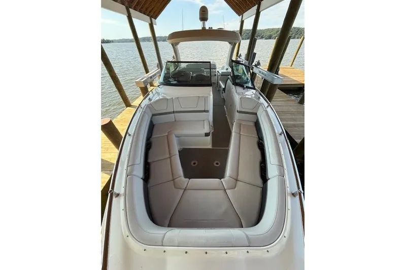 Slide: The Image of 2018 Formula 350 Crossover Bowrider OB, spacious seating, docked by the water. - 26