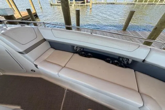 Slide: The Image of 2018 Formula 350 Crossover Bowrider OB, spacious seating, dockside view. - 28