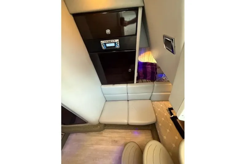 Slide: The Image of 2018 Formula 350 Crossover Bowrider OB cabin interior with seating and control panel. - 33