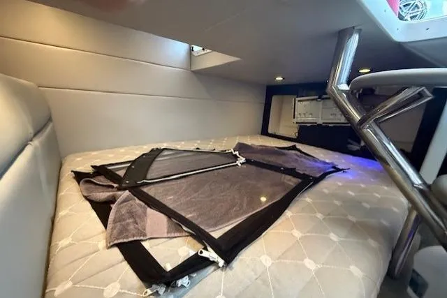 Slide: The Image of 2018 Formula 350 Crossover Bowrider OB cabin interior with bed and window. - 34