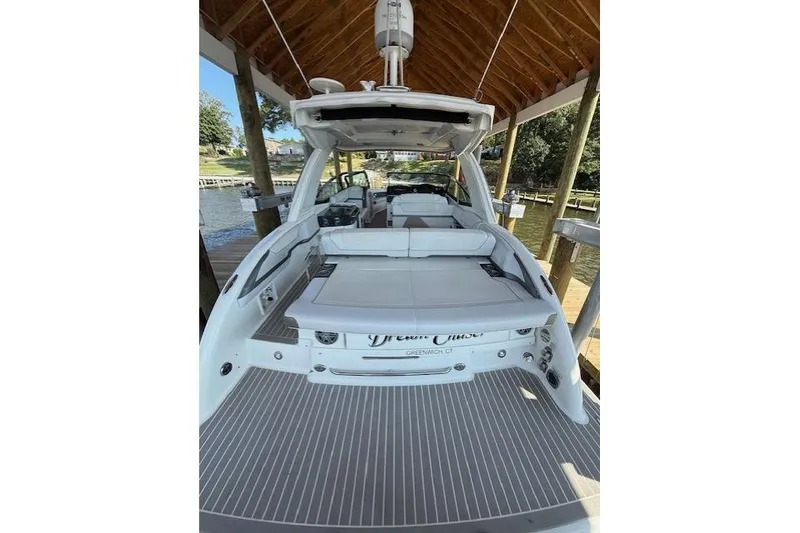 Slide: The Image of 2018 Formula 350 Crossover Bowrider OB docked under a wooden canopy. - 7
