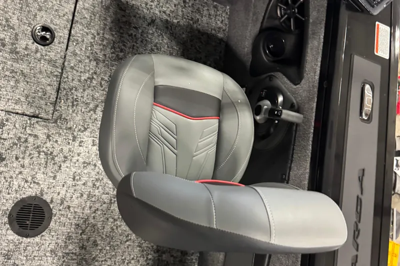 Slide: The Image of 2026 Tracker Targa V-18 Combo boat seat with gray upholstery and red accents. - 12