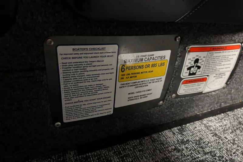 Slide: The Image of Boater's checklist and capacity warning on 2026 Tracker Targa V-18 Combo boat interior. - 15