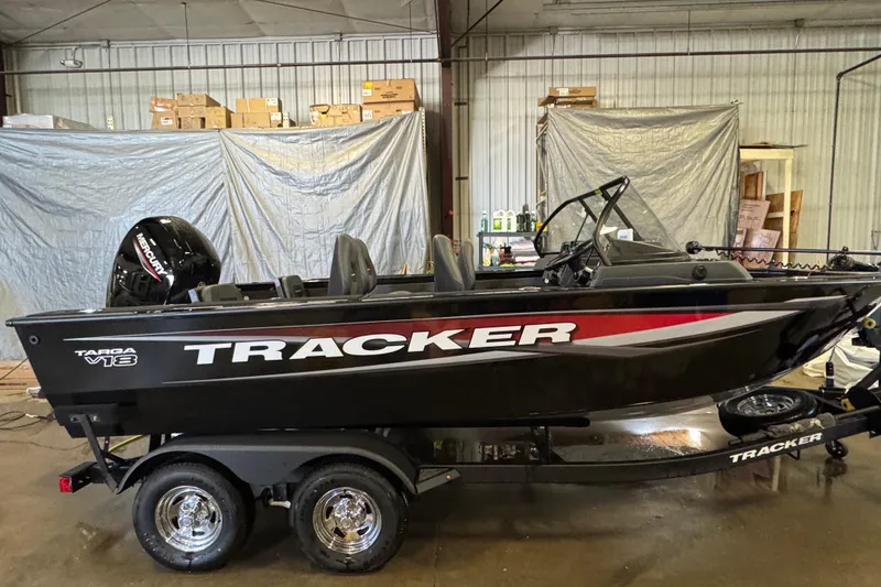 Slide: The Image of 2026 Tracker Targa V-18 Combo boat in a garage setting. - 3