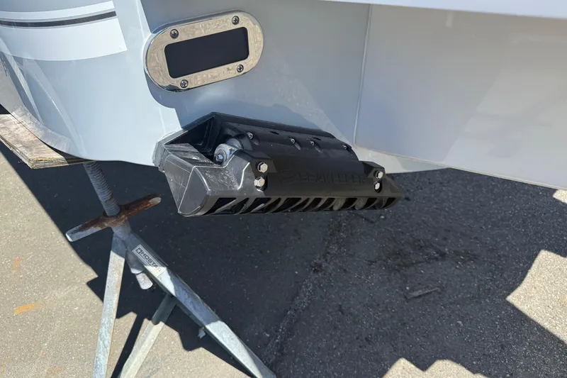 Slide: The Image of 2026 Regulator 25 boat detail showing transom and mounted equipment. - 23
