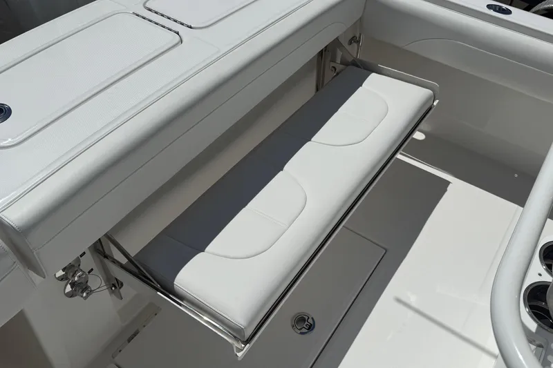 Slide: The Image of 2026 Regulator 25 boat with foldable white bench seat and sleek design. - 39
