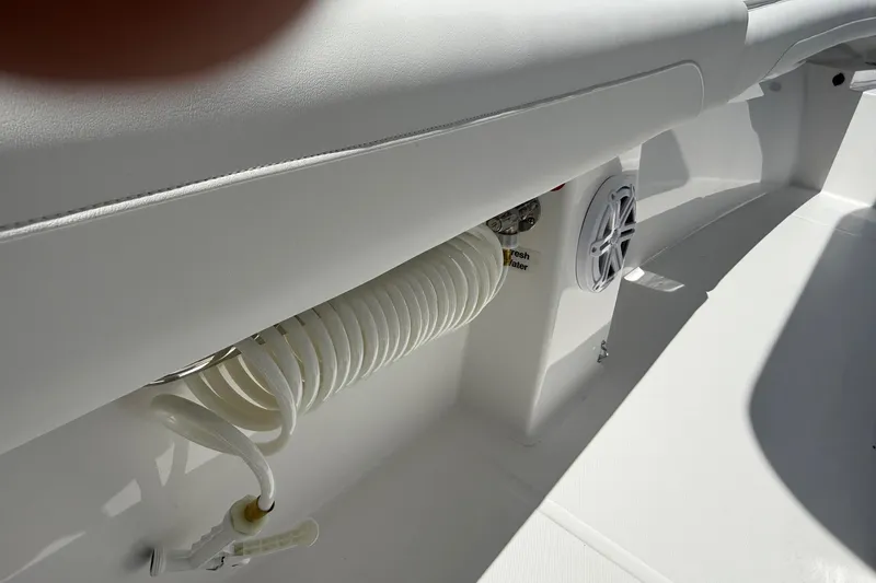 Slide: The Image of 2026 Regulator 25 boat interior with coiled hose and speaker detail. - 56