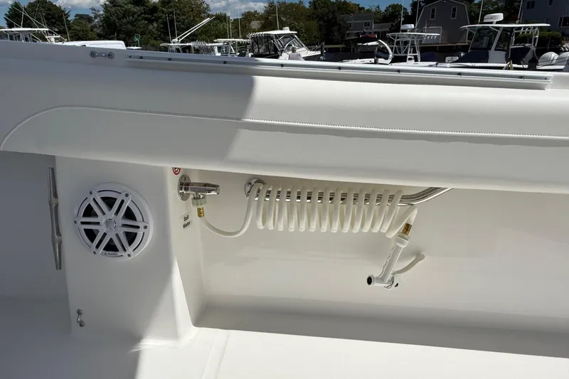 Slide: The Image of 2026 Regulator 25 boat interior with speaker and coiled hose detail. - 57
