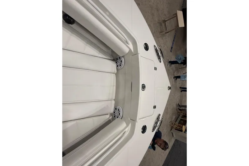 Slide: The Image of 2026 Regulator 25 boat interior with white seating and speakers. - 71