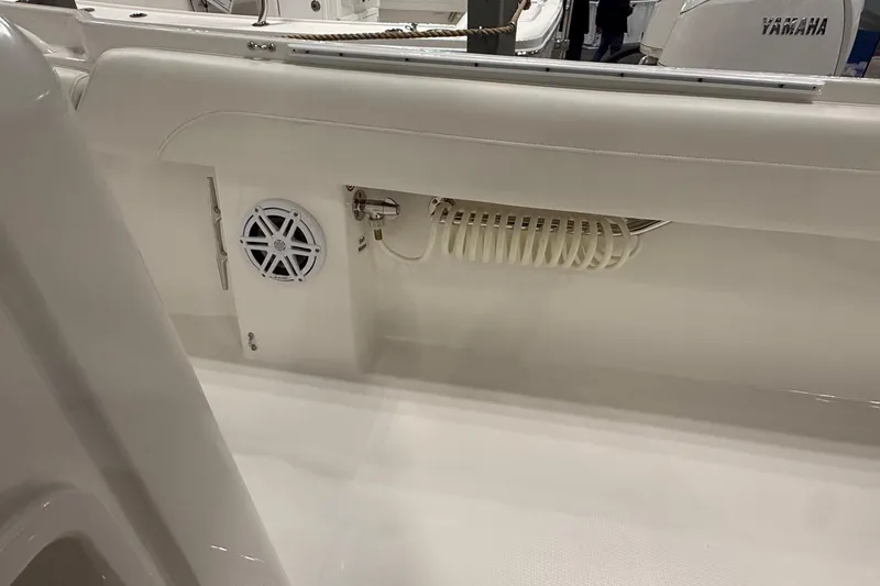 Slide: The Image of 2026 Regulator 25 boat interior with speaker and coiled hose detail. - 77