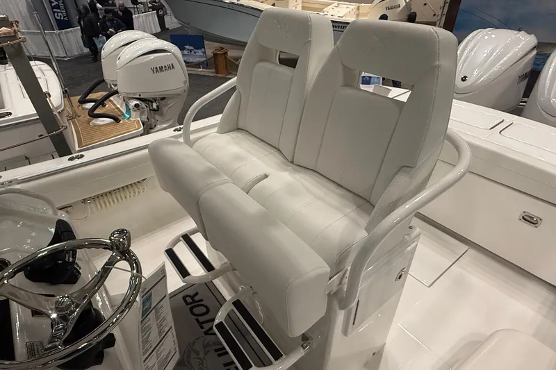 Slide: The Image of 2026 Regulator 25 boat interior with dual white seats and Yamaha engines. - 78