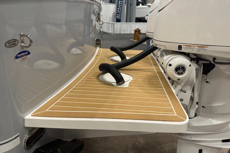 Slide: The Image of 2026 Regulator 25 boat with Yamaha engine, featuring a sleek wooden deck design. - 8