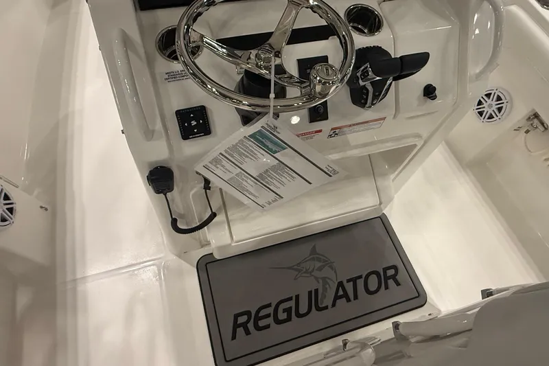 Slide: The Image of 2026 Regulator 25 boat cockpit with steering wheel and controls. - 80