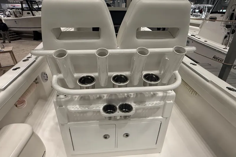 Slide: The Image of 2026 Regulator 25 boat interior with rod holders and storage compartments. - 87