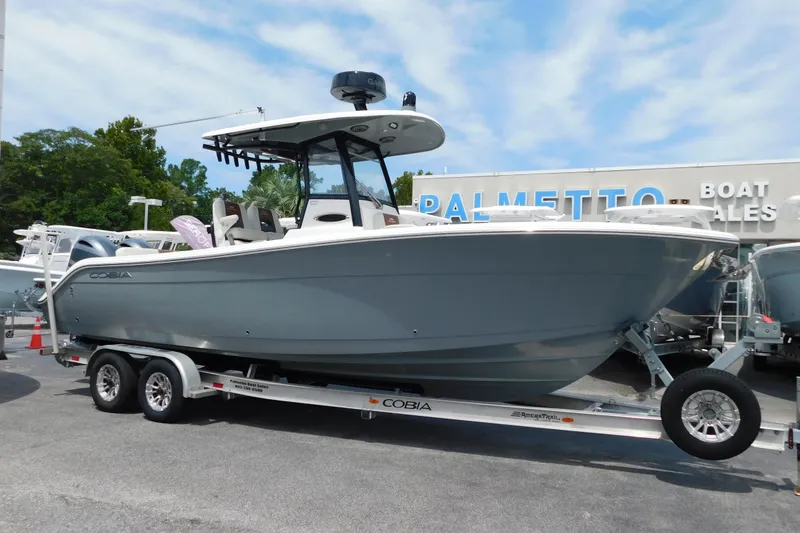 Slide: The Image of 2021 Cobia 262 Center Console boat on trailer at dealership. - 0